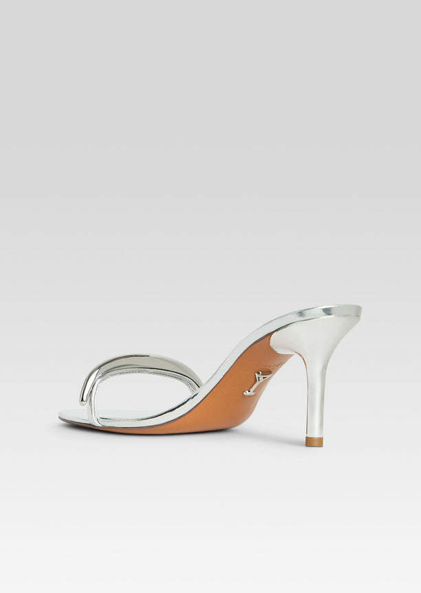 Silver Karli Sandal shown from the side with a tall stiletto heel and two slim straps