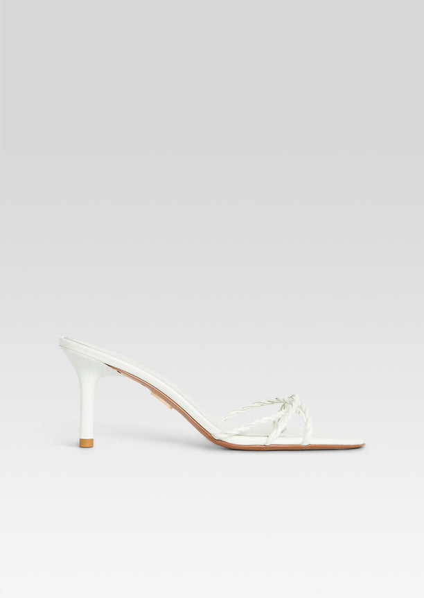 White Karolina sandal with braided straps and slender white heel, side view