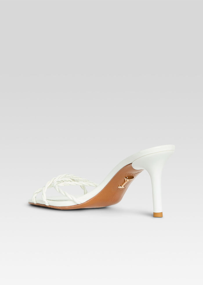 White braided strap high heel sandal with a slim stiletto heel and tan sole. media 5 of 5