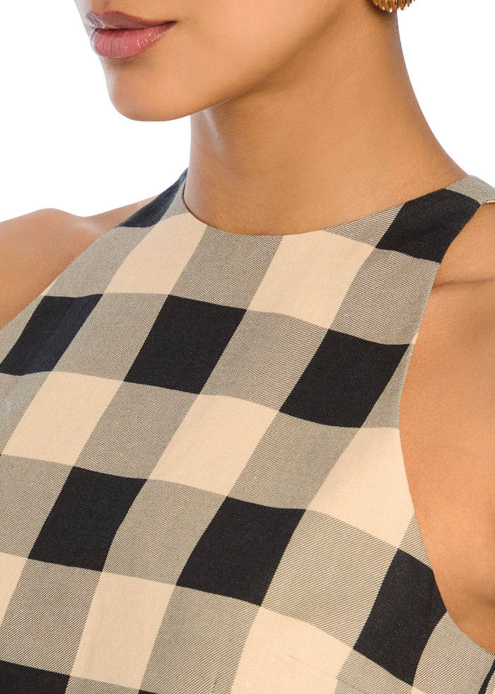 Close-up of beige and black checkered fabric at the romper’s neckline and shoulder. media 2 of 5