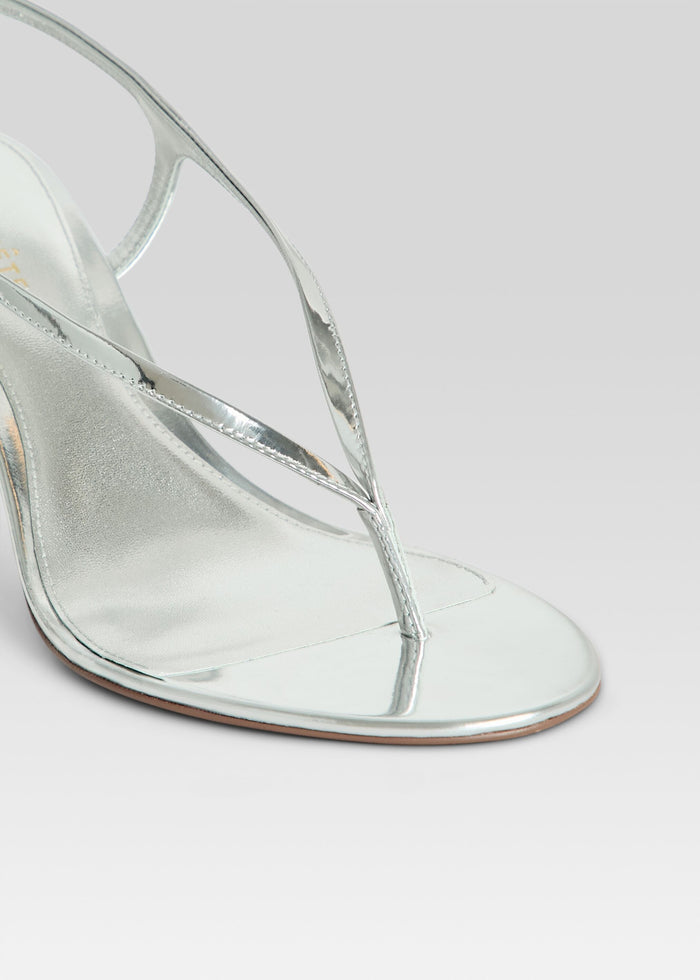 Close up of metallic silver Klotilde Sandal showing slim cross straps over the toe area media 3 of 5
