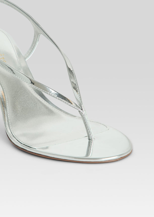 Close up of metallic silver Klotilde Sandal showing slim cross straps over the toe area