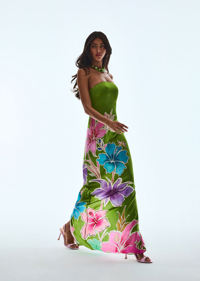 Full length view of a model wearing the Vivi Silk Dress in lime green with a bold tropical floral print. media 2 of 6