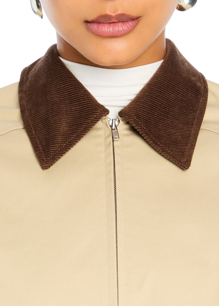 Close-up of a beige Marielle Jacket with a brown corduroy collar and front zipper. media 2 of 5