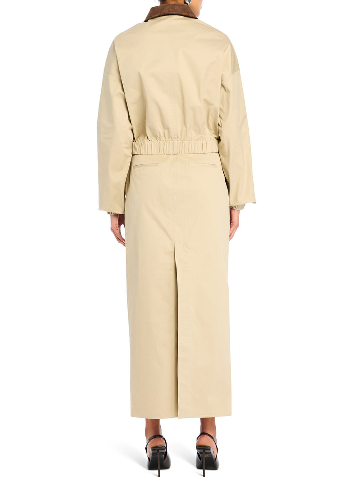 Back view of the beige Marielle Jacket with an elastic waistband and long straight silhouette. media 4 of 5