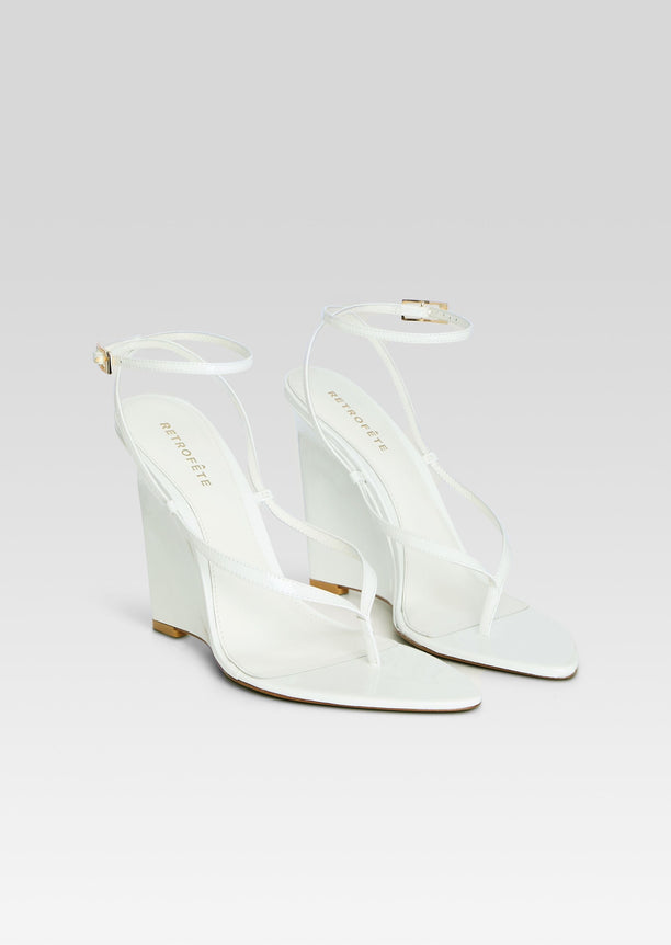 Namby Wedge white sandal with strappy upper and ankle buckle