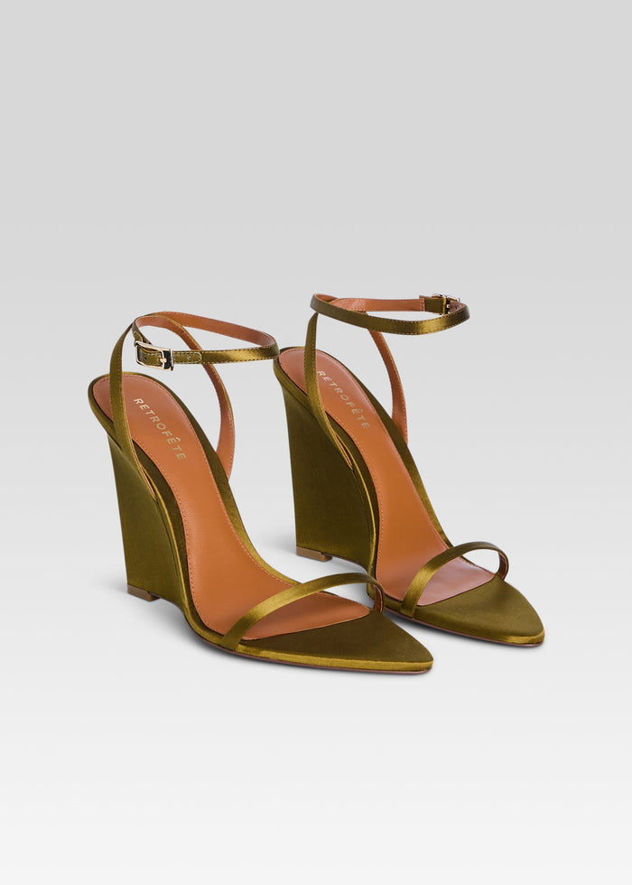 Olive green wedge sandals with thin gold metallic straps and ankle buckle shown from the front media 4 of 5