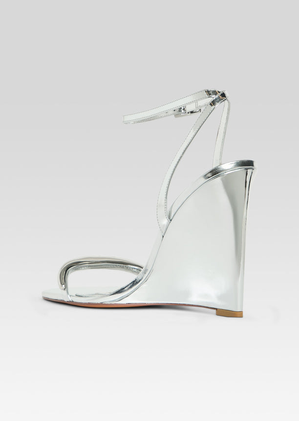 Nola wedge sandal in metallic silver with ankle strap, side view