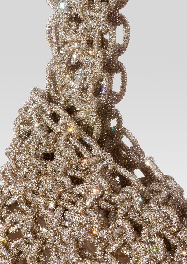 Close-up of a crystal encrusted Niky Bag with abundant rhinestones sparkling.