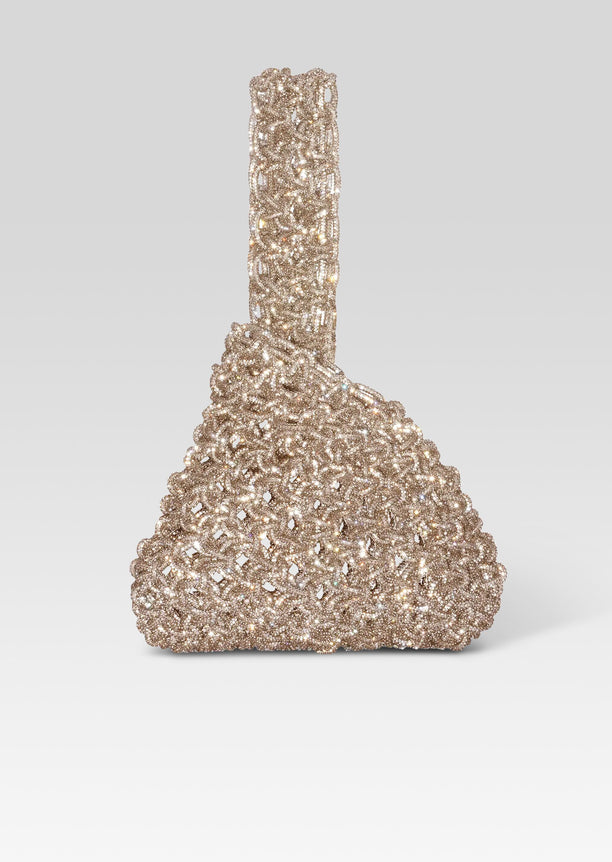 Niky Bag in champagne crystals with a rounded lattice base and crystal strap