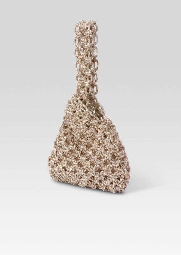 Close up of Niky Bag in champagne crystals with an intricate lattice pattern