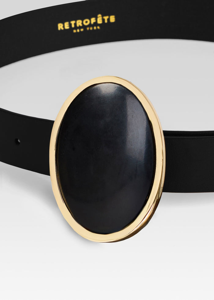 Close-up of the Pertie Belt with a large oval black stone set in a gold-tone bezel media 2 of 3