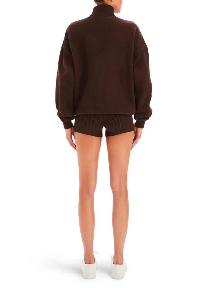 Back view of a model in a chocolate brown Bay Short set showing an oversized fleece top and ribbed shorts. media 4 of 5