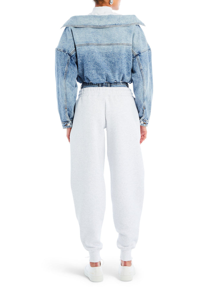 Back view of a light washed Caroline Jacket with an oversized collar and gathered waist media 4 of 4