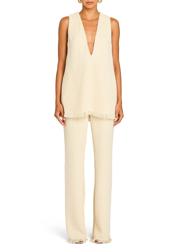 Cream boucle pants set with a matching sleeveless top featuring a plunging V neck and fringed edges. media 5 of 5