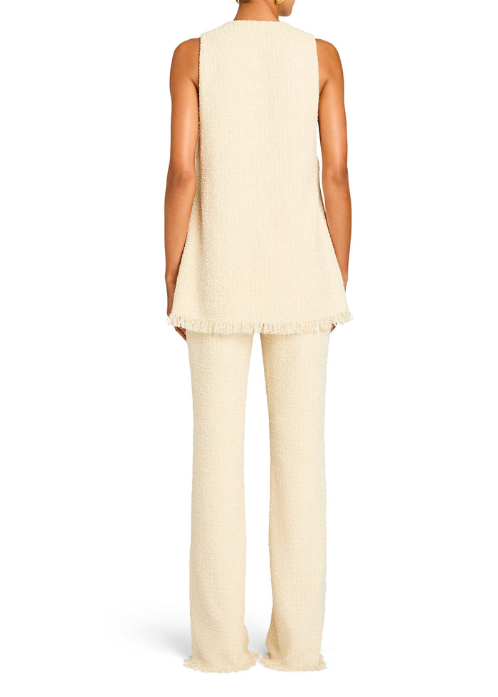 Back view of a model wearing a cream boucle sleeveless top and matching wide-leg pants. media 4 of 5