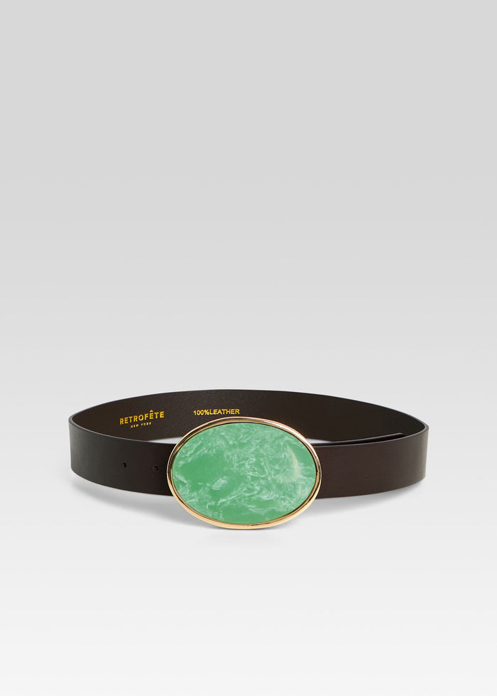 Dagmar high waist leather belt with a large green oval buckle accented by gold trim media 1 of 3