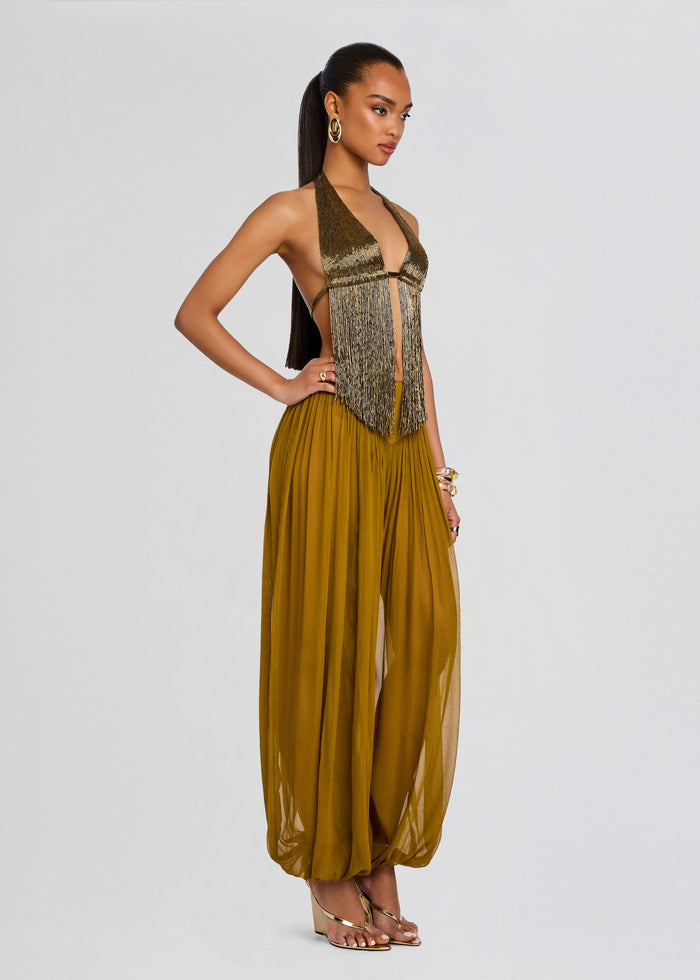 Model in Sereya Embellished Top with metallic fringe and mustard wide leg pants. media 4 of 6