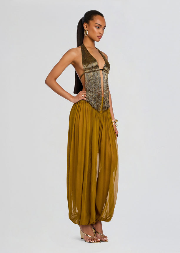 Model in Sereya Embellished Top with metallic fringe and mustard wide leg pants.