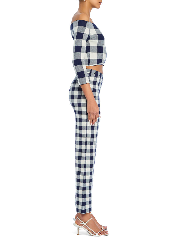 Side view of navy and white gingham off-shoulder crop top with three-quarter sleeves and matching high-waisted pants media 3 of 5