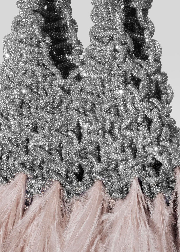Close-up of the silver beaded surface of the Vannifique Mini Feathers Bag with pink feather trim media 2 of 3
