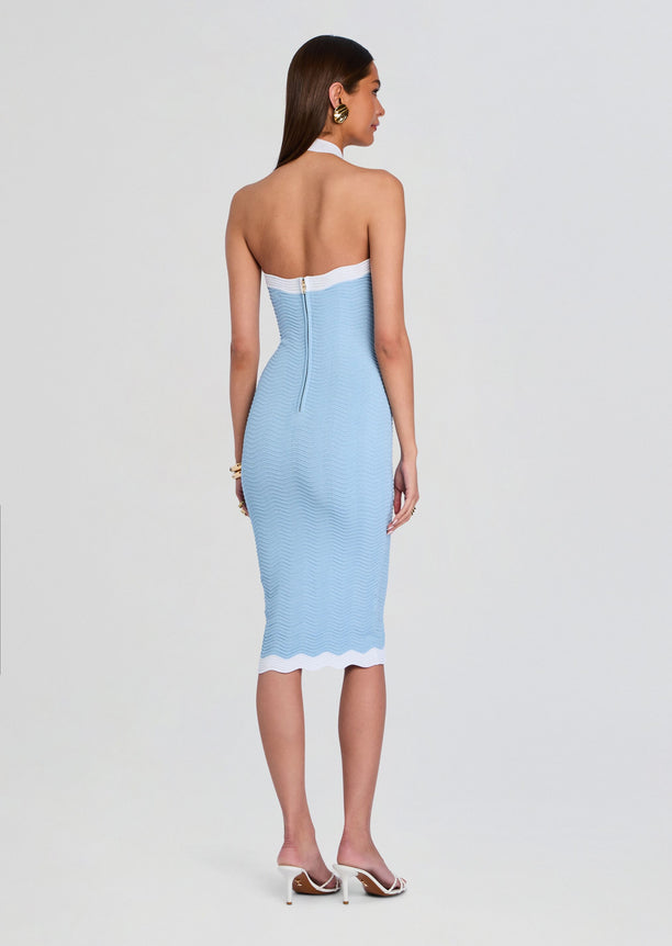 Back view of light blue rib knit midi dress with white halter trim and back zipper.