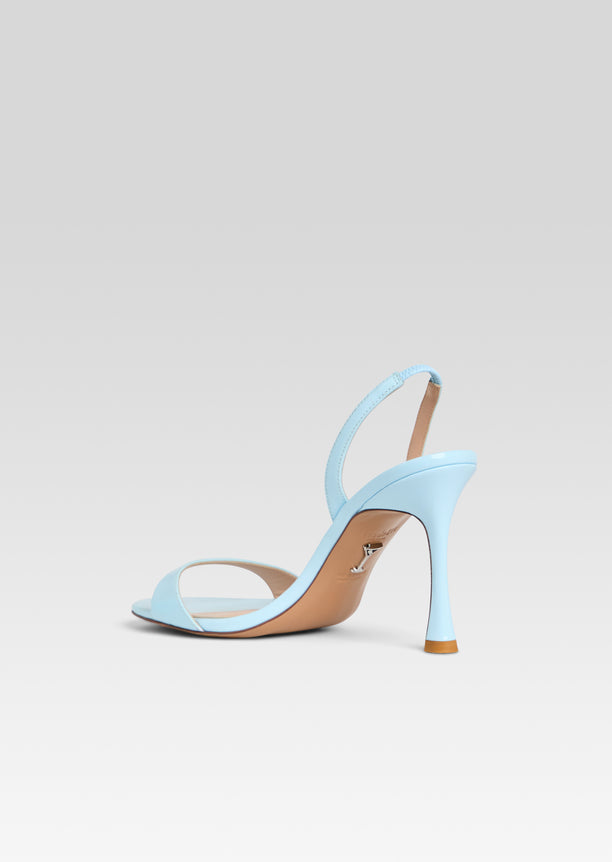 Single light blue Fortune Sandal viewed from the side with ankle strap and stiletto heel.