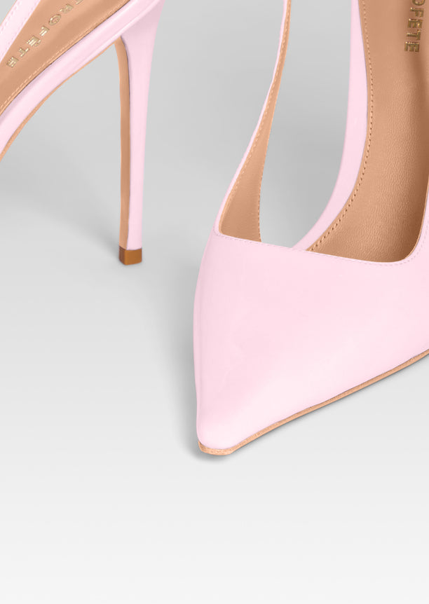 Close up of pink pointed toe slingback heel with strap and beige sole detail