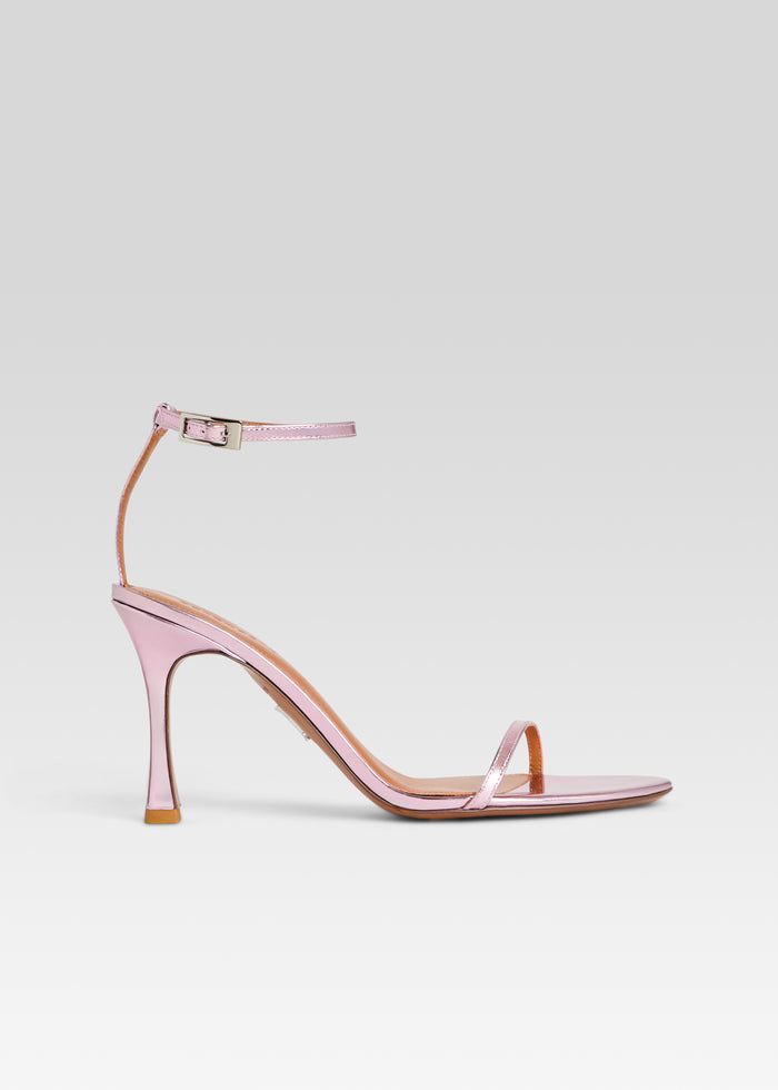 Pink metallic Fowla sandal with an ankle strap and thin toe strap. media 1 of 5