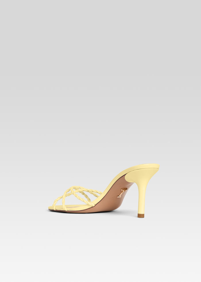 Karolina Sandal side view in pale yellow with braided front straps and a slender stiletto heel media 5 of 5