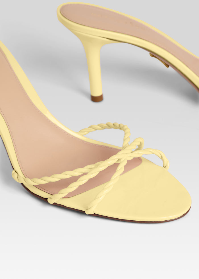 Close up of Karolina Sandal with braided pale yellow straps and open toe. media 3 of 5