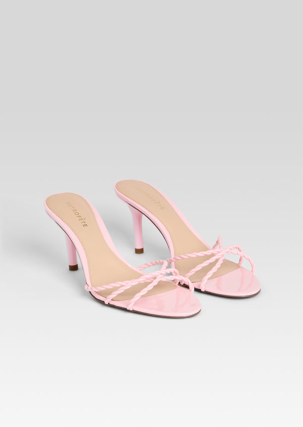 Two pink Karolina sandals with braided front straps and slender stiletto heels
