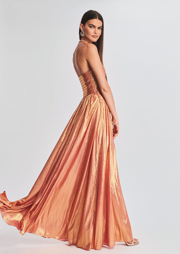 Side view of a strapless metallic copper Waldorf Dress featuring a ruched bodice and long flowing skirt.